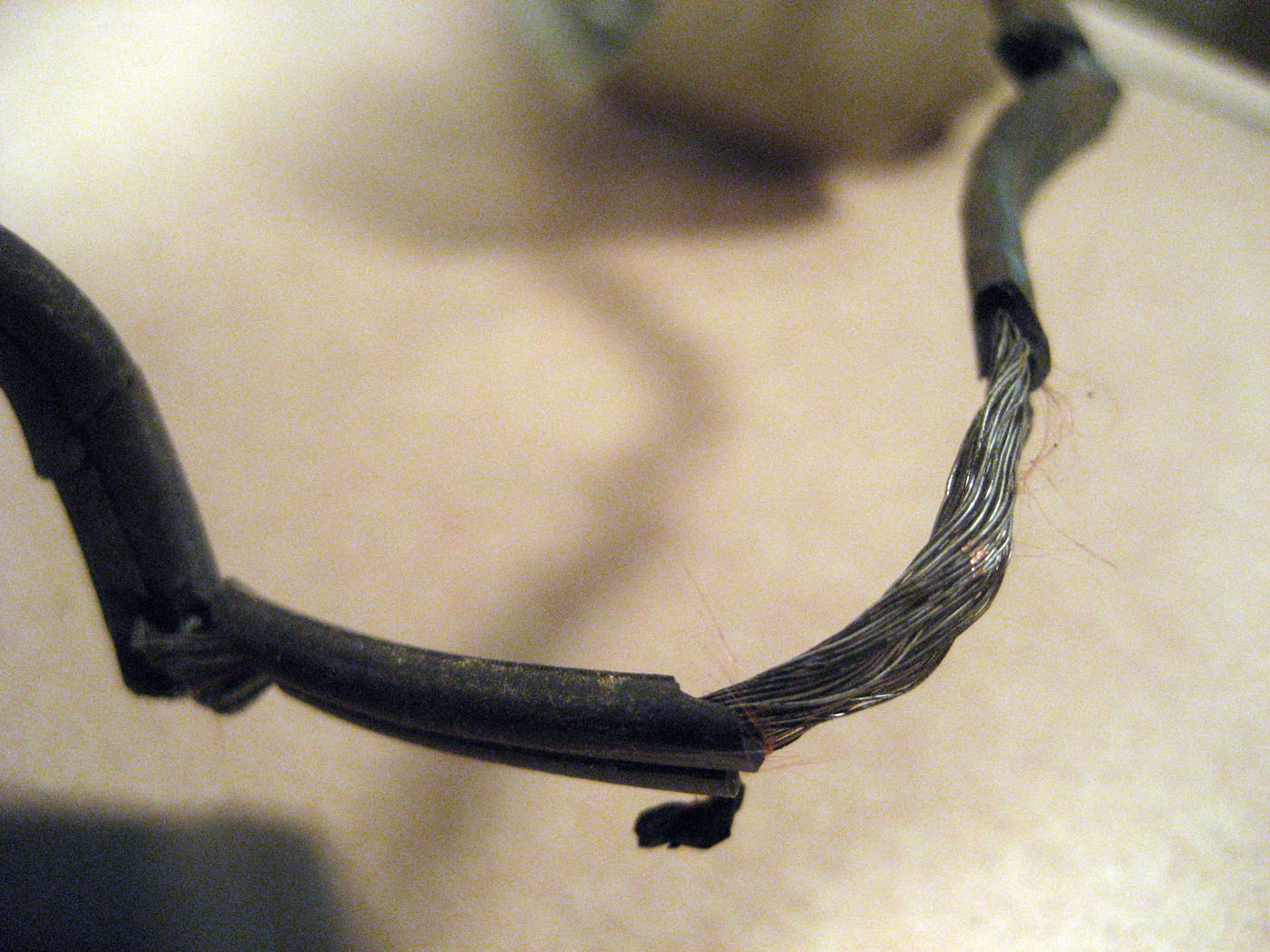 Kinked wire with crumbling insulation.